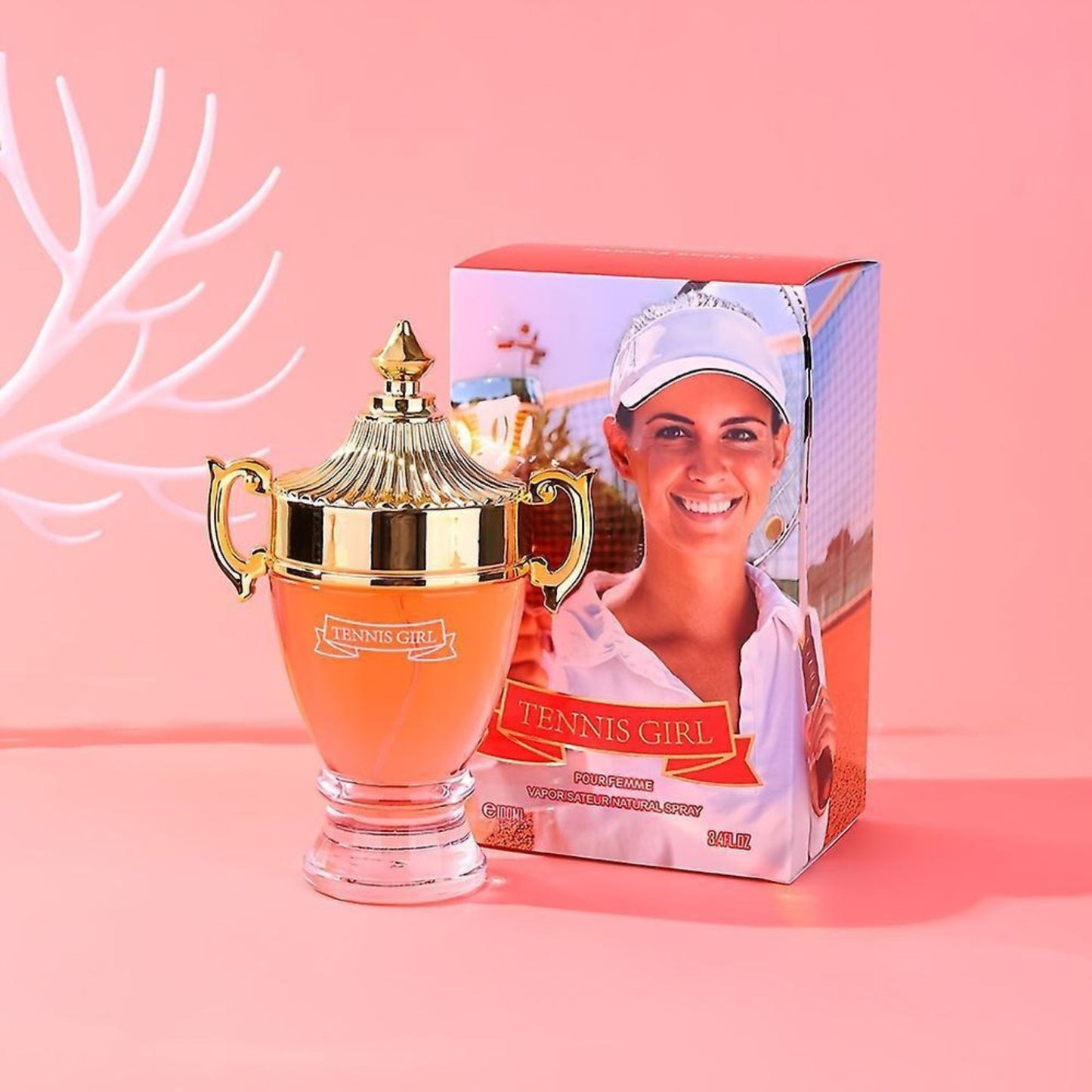 Tennis-themed product with a gold cup and packaging featuring a tennis player on a pink background