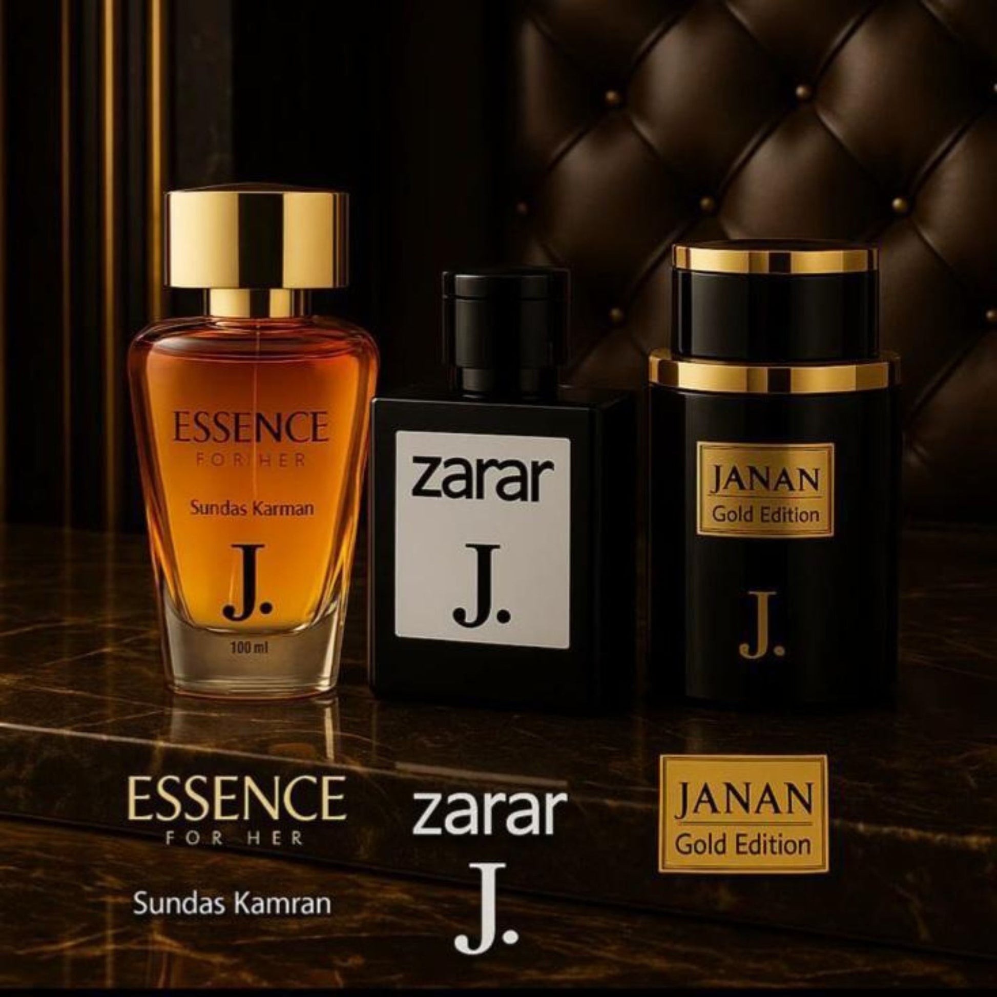 Three perfume bottles labeled 'Essence for Her', 'Zarar J.', and 'JANAN Gold Edition' on a dark surface.